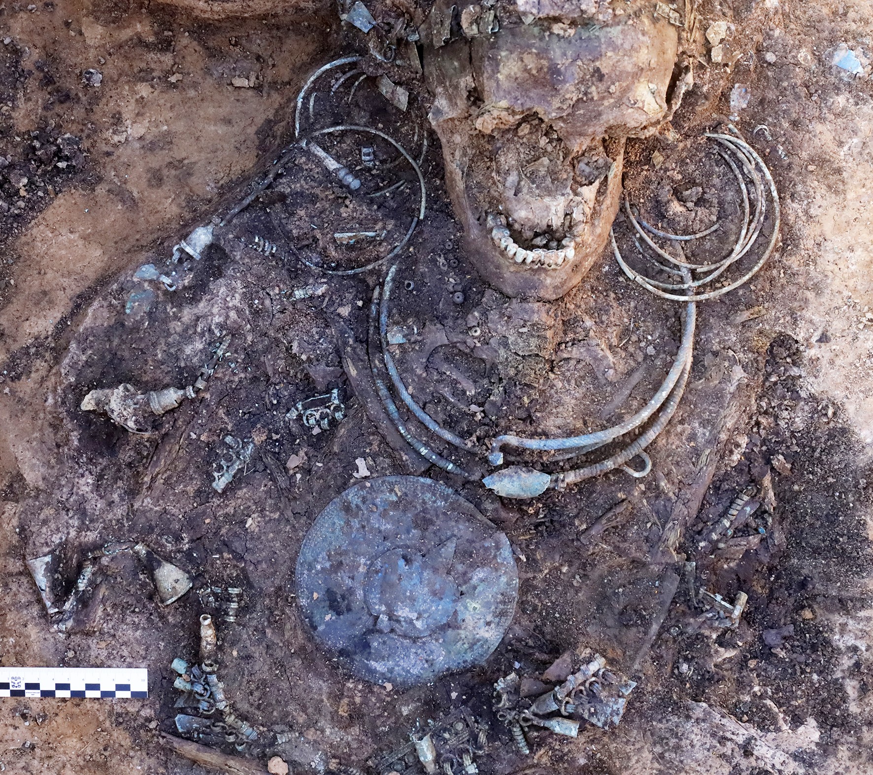 A tall headdress in a riverbank grave