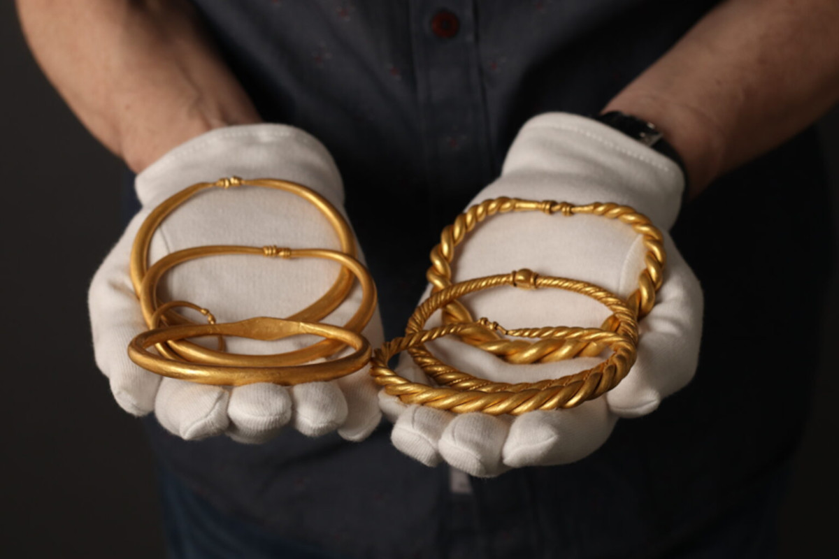 Six gold bracelets in the woods